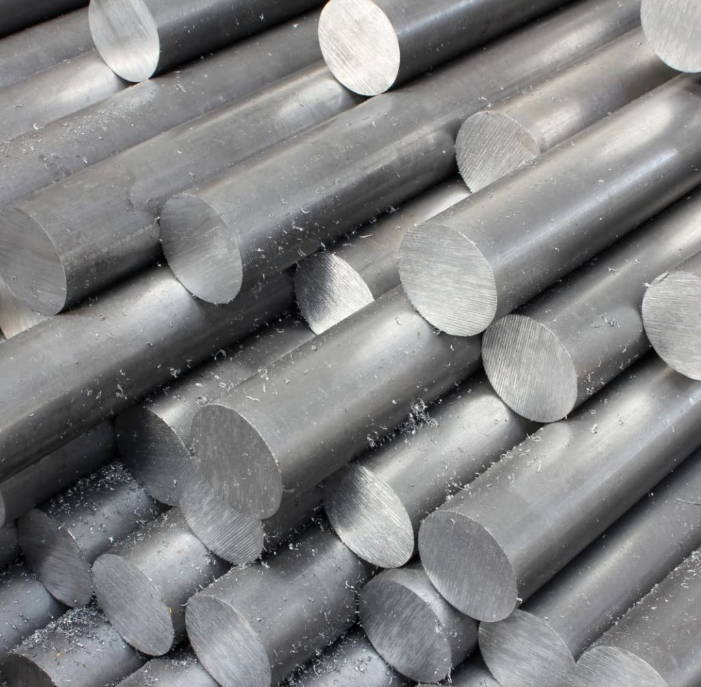 close up picture of raw bars of aluminum in a stack. 