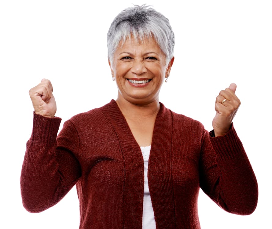 women smiling with hands in the air cheering