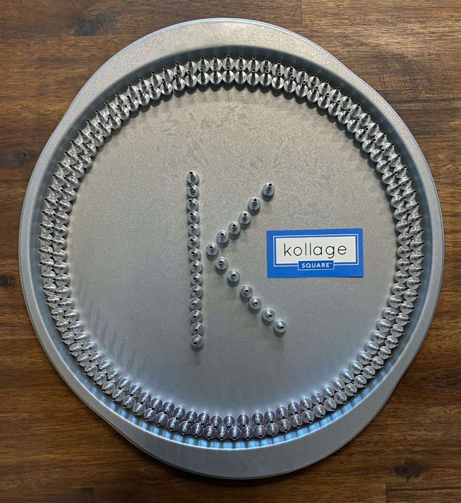 End stoppers on a silver tray, arranged in a K for Kollage